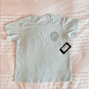 light blue shirt, with jacks logo